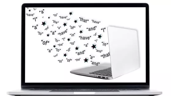 Image of words emerging from a laptop